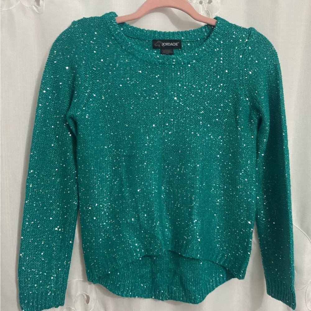 Jordache Brand, Girl’s Teal and Sequined Crew Neck Sweater; High Low at Bottom
